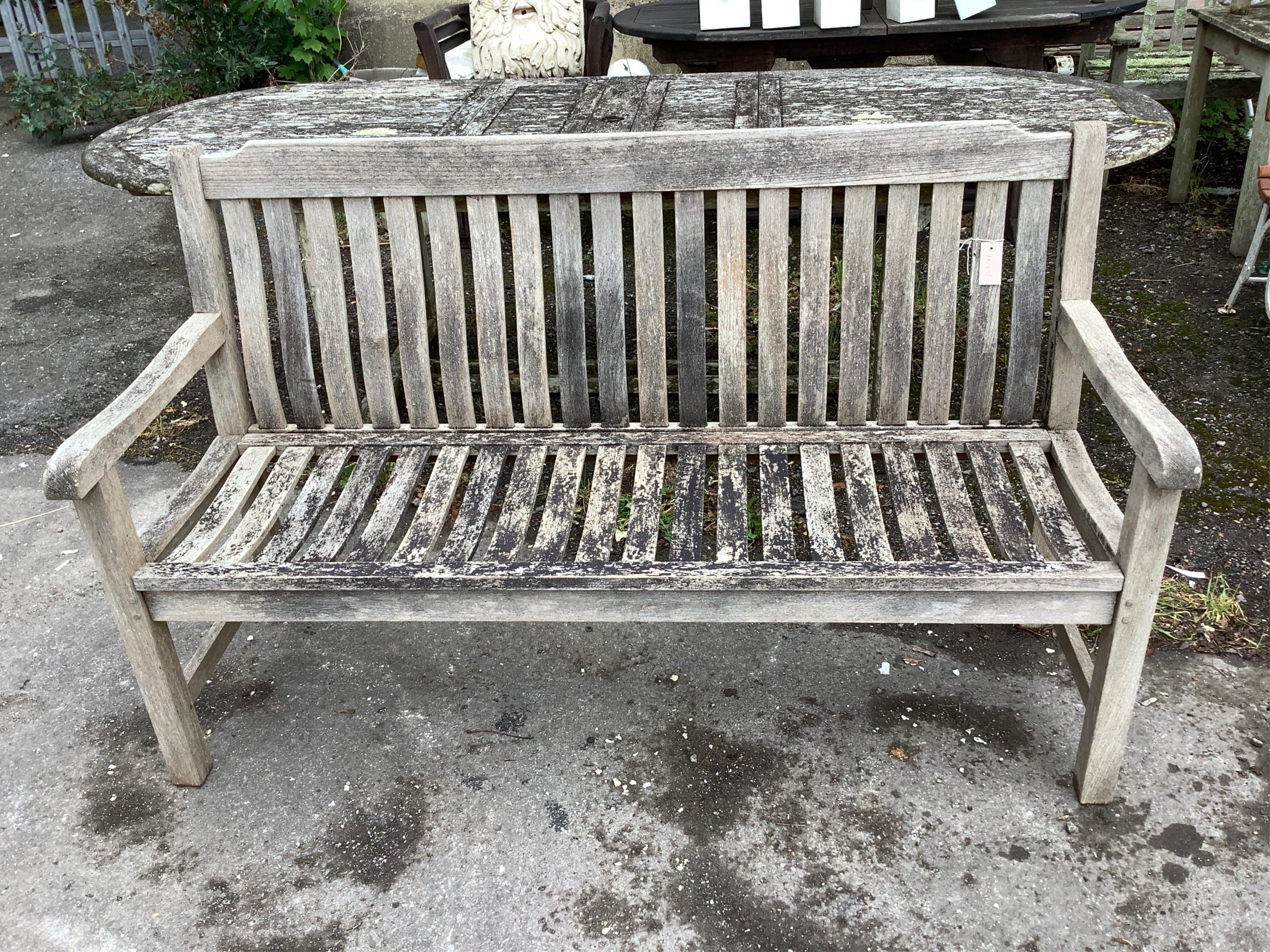 A weathered teak slatted garden bench by Neptune,width 154cm, depth 58cm, height 92cm